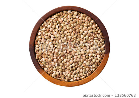 Raw organic buckwheat seeds in a wooden bowl isolated on white background 138560768