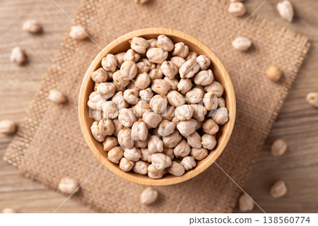 Organic raw chickpeas in a wooden bowl, healthy food ingredient, Table top view 138560774