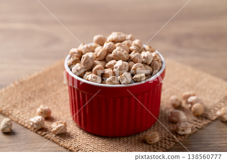 Organic raw chickpeas in a red bowl, healthy food ingredient Organic raw chickpeas in a red bowl, healthy food ingredient 138560777