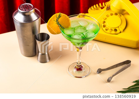 Retro green cocktail against a red curtain 138560919