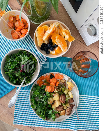 Stewed duck fillet with potatoes and asparagus and radishes, mixed salad of various greens, baked carrots in tahini sauce, healthy delicious breakfasts or lunches 138561164