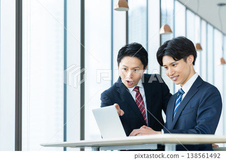 Businessmen working in an office. Photo courtesy of Denpa Gakuen, Tokyo Electronics College. Businessmen working in an office. Photo courtesy of Denpa Gakuen, Tokyo Electronics College. 138561492