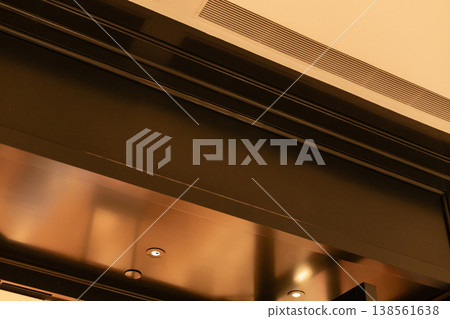 Storefront shows an empty facade with clear space for signage and branding. The shop is located in an active commercial area with potential for various retail activities 138561638