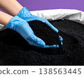 Activated carbon powder in a white bag, a large amount of charcoal 138563445