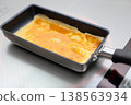 Cook an omelet 138563934