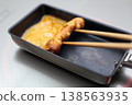 Cook an omelet 138563935