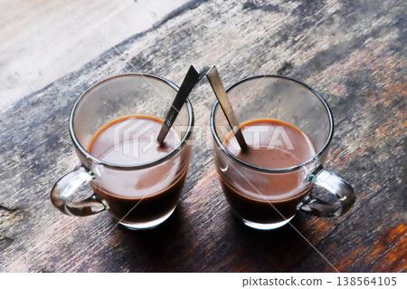 Top view of Two glass cup of hot coffee on wooden table for breakfast 138564105