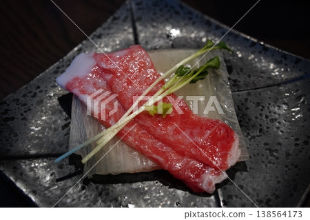 Close up of marbled fatty tuna sashimi slice (Otoro) served in a luxury restaurant 138564173