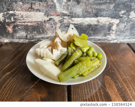 Traditional Japanese pickled vegetables. Pickles made from lotus root, green beans, snap peas, and yam. Traditional Japanese pickled vegetables. Pickles made from lotus root, green beans, snap peas, and yam. 138564324