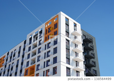 Skyscraper. New building. Orange and white skyscraper. Real estate agent. House for sale sign. 138564499