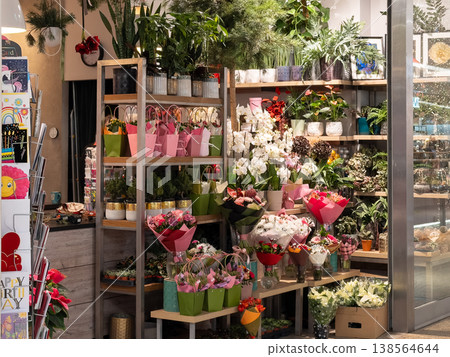 Vibrant flower shop interior showcasing abundant fresh bouquets, potted plants, and diverse floral arrangements, ideal for retail business and thoughtful gift selection 138564644