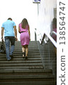 Couple walking up stairs at the underground pedestrian crossing in the city 138564747