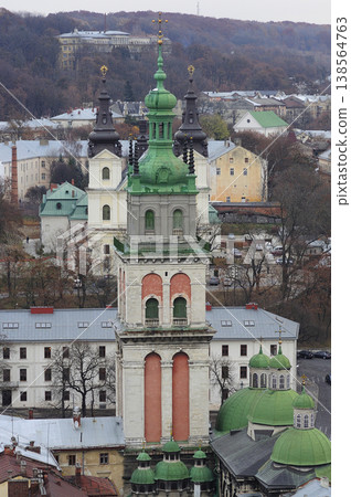 The Korniakt Tower and Dormition Church in Lviv with historic city architecture and hills, Ukraine The Korniakt Tower and Dormition Church in Lviv with historic city architecture and hills, Ukraine 138564763