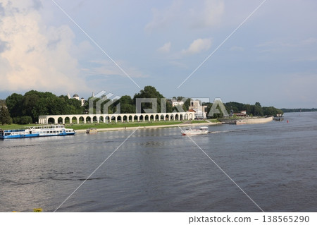 Riverside colonnade promenade with tour boat and visitors Riverside colonnade promenade with tour boat and visitors 138565290