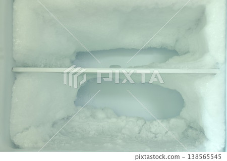 ice frosting in freezer refrigerator waiting for cleanup ice frosting in freezer refrigerator waiting for cleanup 138565545