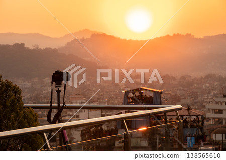 A camera on tripod setting for capture the beautiful moment of Kathmandu the capital city of Nepal at sunset. 138565610