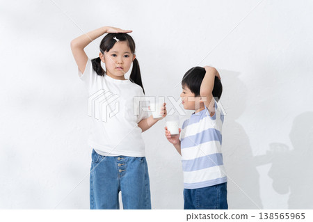 Boys and girls drinking milk Boys and girls drinking milk 138565965
