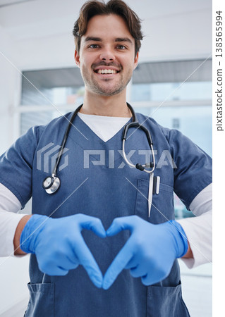 Portrait, hospital and hands in heart of doctor for medicine, surgery and working in clinic for wellness. Healthcare, emoji and man with hand sign for safety, insurance or support for medical service Portrait, hospital and hands in heart of doctor for medicine, surgery and working in clinic for wellness. Healthcare, emoji and man with hand sign for safety, insurance or support for medical service 138565994