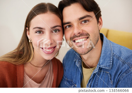 Portrait, couple or smile with love, care and bonding on sofa in living room of home or apartment. People, man or woman with happiness, romance and support on couch in lounge of house for commitment 138566066