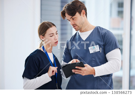 Healthcare, doctor and nurse with tablet, discussion and schedule at hospital with teamwork. Medical professional, man and woman with digital app for telehealth, health insurance website and advice. 138566273
