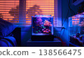 small aquarium with coral and clownfish sits on top of an end table in the corner of my bedroom at night. the lights from outside the window cast a blue light into the room 138566475