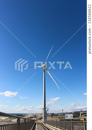 Wind turbines in Kakegawa City, Shizuoka Prefecture, stand tall against the blue sky. 138566621