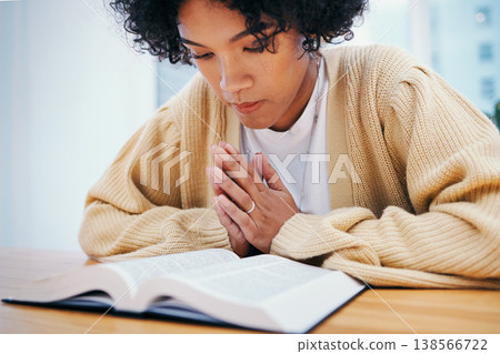 Woman, bible and prayer at desk, religion and Christian worship in home at table. Person, holy book and meditation for God, Jesus Christ and studying for faith in spiritual gospel, praise or reading Woman, bible and prayer at desk, religion and Christian worship in home at table. Person, holy book and meditation for God, Jesus Christ and studying for faith in spiritual gospel, praise or reading 138566722