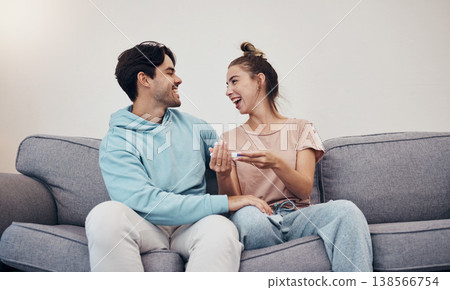 Pregnancy test, happy and couple in home living room, reading good news or check results. Kit, excited man and pregnant woman or mother smile on sofa for success, future maternity or ivf fertility 138566754