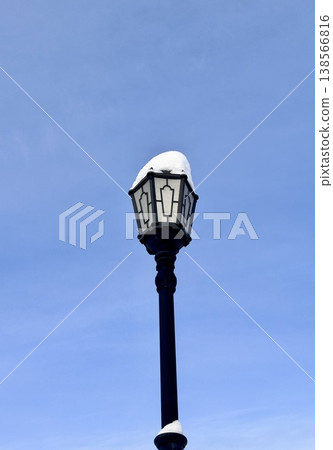 city street lamp on the background of the blue sky in winter city street lamp on the background of the blue sky in winter 138566816