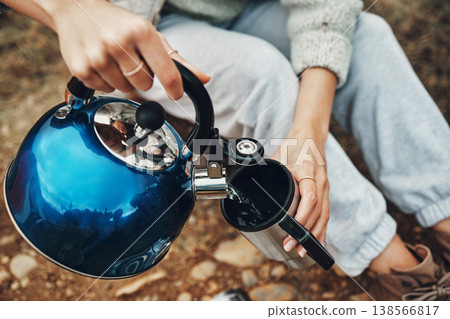 Camping, water and hands with mug for coffee in morning for trekking, adventure and freedom. Travel, nature and person with kettle for warm drink, beverage and tea on holiday, vacation and tourism Camping, water and hands with mug for coffee in morning for trekking, adventure and freedom. Travel, nature and person with kettle for warm drink, beverage and tea on holiday, vacation and tourism 138566817
