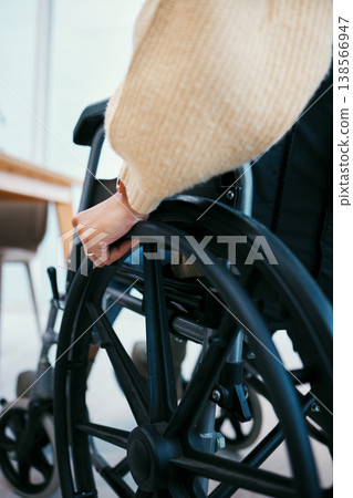 Hand, wheelchair and patient with a disability closeup in a home for recovery or mobility from the back. Healthcare, medical and injury with a person in a hospital or clinic for rehabilitation Hand, wheelchair and patient with a disability closeup in a home for recovery or mobility from the back. Healthcare, medical and injury with a person in a hospital or clinic for rehabilitation 138566947