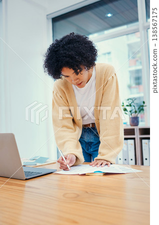 Woman with laptop, notes and research in office with admin, internet and creative ideas for freelance project. Remote work, paperwork and girl standing with computer, writing and document for agenda. Woman with laptop, notes and research in office with admin, internet and creative ideas for freelance project. Remote work, paperwork and girl standing with computer, writing and document for agenda. 138567175