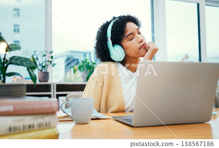 Music, headphones and meditation of business woman on laptop in startup office. Radio, relax and professional at desk listening to sound, audio and streaming podcast online for peace, calm and zen 138567186