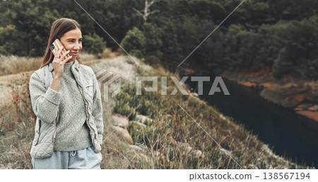 Phone call, hiking and happy woman in nature, talking or listening to communication for connection. Mobile, smile and person in conversation in woods, trekking and travel on holiday outdoor in forest Phone call, hiking and happy woman in nature, talking or listening to communication for connection. Mobile, smile and person in conversation in woods, trekking and travel on holiday outdoor in forest 138567194