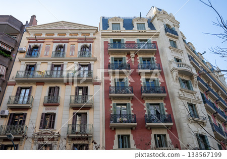 Colorful classic residential buildings with ornate balconies and shutters in Barcelona urban architecture Colorful classic residential buildings with ornate balconies and shutters in Barcelona urban architecture 138567199