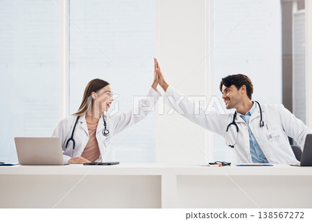 Success, high five or doctors in meeting for a strategy, goals or working in hospital for healthcare together. Man, happy woman or excited surgeons with nursing target, medical mission or teamwork Success, high five or doctors in meeting for a strategy, goals or working in hospital for healthcare together. Man, happy woman or excited surgeons with nursing target, medical mission or teamwork 138567272