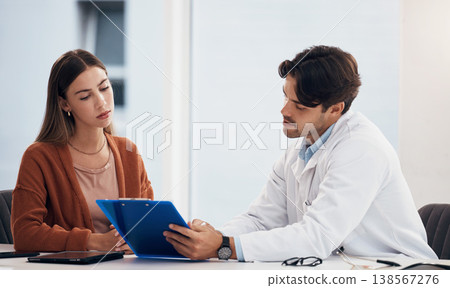 Doctor, woman and checklist document in consultation, healthcare advice and registration or clinic sign up. Medical worker with young patient in hospital office for charts, information or progress 138567276