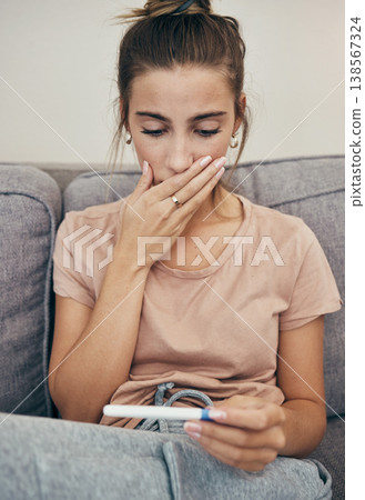 Pregnancy test, shock and sad woman on sofa in home, reading bad news and check negative exam results. Stick, surprise and pregnant mother depressed in living room for maternity, stress and anxiety Pregnancy test, shock and sad woman on sofa in home, reading bad news and check negative exam results. Stick, surprise and pregnant mother depressed in living room for maternity, stress and anxiety 138567324
