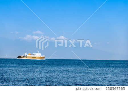 The Suruga Bay Ferry "Fuji" departing from Shimizu Port, with snow-covered Mount Fuji in the background. The Suruga Bay Ferry "Fuji" departing from Shimizu Port, with snow-covered Mount Fuji in the background. 138567365