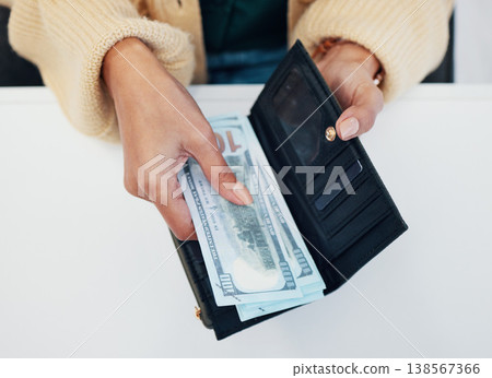 Woman, hands and wallet with money for savings, investment or payment on counter at checkout. Top view or closeup of female person with cash, bills or paper notes for finance, purchase or shopping 138567366