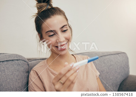 Pregnancy test, smile and woman on sofa in home, reading good news and check positive results. Pregnant, stick and happy mother in living room excited for success, future maternity and ivf fertility 138567418