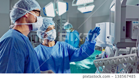 Hospital, doctor and patient monitor for surgery, operating room and setting machine. Operation, medical or diagnosis for high blood pressure, vital signs and data change in anesthesia, type or check Hospital, doctor and patient monitor for surgery, operating room and setting machine. Operation, medical or diagnosis for high blood pressure, vital signs and data change in anesthesia, type or check 138567485
