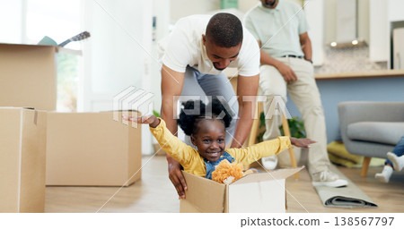 Father, child and playing in a box while moving house with a black family together in a living room. Man and a girl kid excited about fun game in their new home with a smile, happiness and adventure 138567797