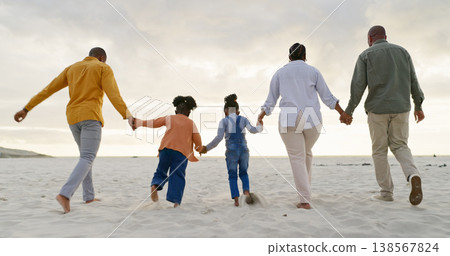 Happy, love and holding hands with black family at beach for summer, vacation and relax. Holiday, support and travel with parents and children walking on coastline for care, trust and freedom Happy, love and holding hands with black family at beach for summer, vacation and relax. Holiday, support and travel with parents and children walking on coastline for care, trust and freedom 138567824