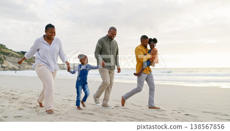 Happy, walking and a black family at the beach, holding hands and talking on a holiday. Sunset, conversation and grandparents, father and children on a walk by the sea during a vacation for travel Happy, walking and a black family at the beach, holding hands and talking on a holiday. Sunset, conversation and grandparents, father and children on a walk by the sea during a vacation for travel 138567856