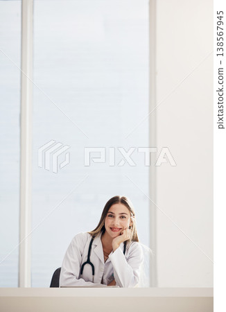 Portrait, doctor and smile with a woman in a hospital for healthcare, consulting or trust on space. Medical, mockup and a happy young medicine professional at a desk in a clinic for cardiology 138567945