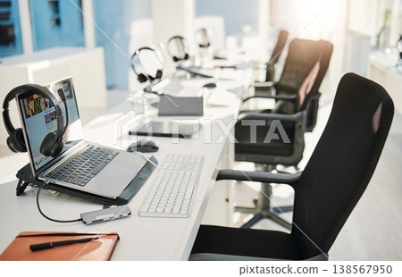 Empty office, call center and headphones with laptop, chair and furniture for telemarketing with voip tech. Help desk, computer and customer service with contact us, technical support or consulting 138567950