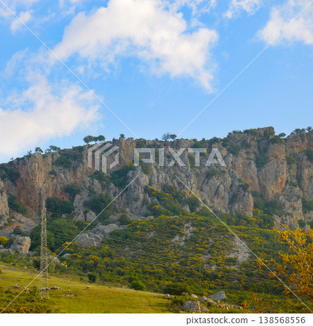 Majestic Taurus Mountains Scene with Power Lines and Blue Cloudy Sky 138568556