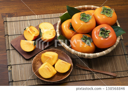 Persimmons in a colander 138568846