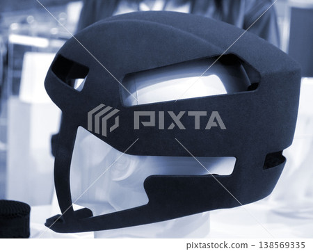 Protective helmet. Helmet printed on 3D printer from powder material. Model printed on 3D printer from melted polyamide powder. Multi Jet Fusion. Modern additive progressive 3D printing technology 138569335